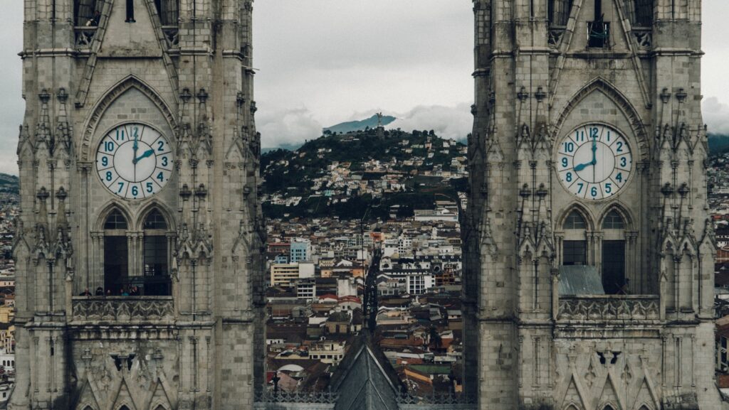 close-up photography of gray concrete clock towers